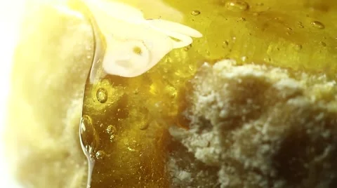 Honey on a piece of bread macro clip Stock Footage 58788630