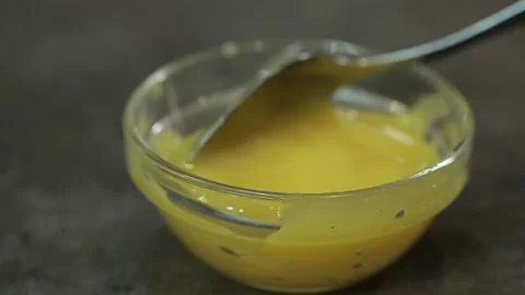 Honey in a plate Stock Footage 154707359