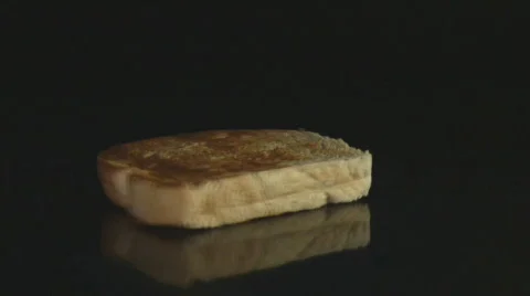 Honey poured on slice of toasted bread Stock Footage 107724