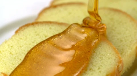 Honey pouring on bread, Slow Motion Stock Footage 12549388
