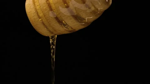 Honey pouring from dripper Stock Footage 167352990