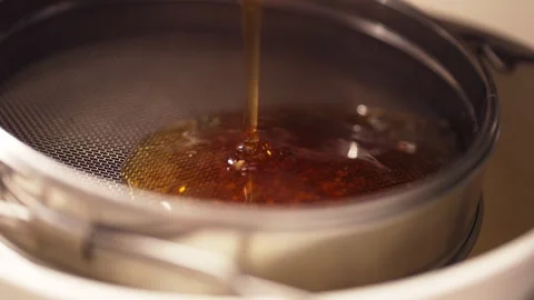 Honey pouring out of extractor close-up Stock Footage 287894084