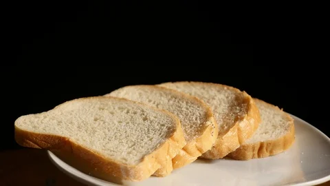 Honey pours on pieces of bread Stock Footage 84968201
