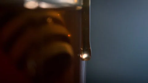 Honey running slowly down the side of a jar Stock Footage 274702203