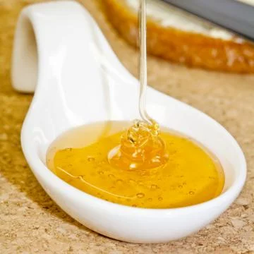 Honey in spoon Foto stock