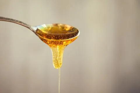 Honey in spoon Foto stock