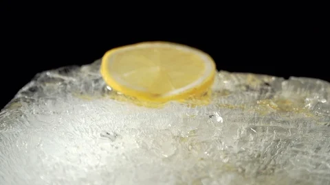 Honey spreads on ice to which mint falls Stock Footage 85860669