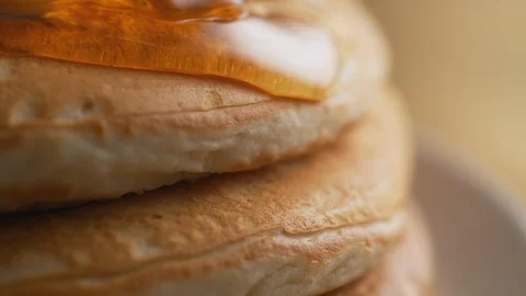 Honey on stack of pancake. Slow Motion. Stock Footage 89602778