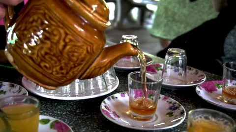Honey tea poured in slow motion in Vietnam Stock Footage