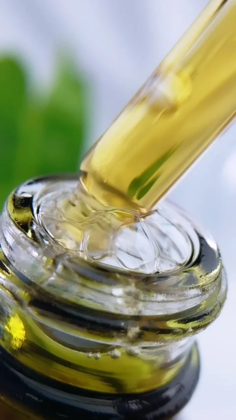 Honey yellow liquid in a bottle being sampled using a serum pipette. Natura.. Stock Footage 340511379