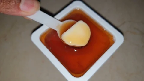 Honey on yogurt Video stock 129345835