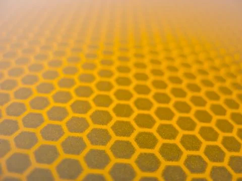 Honeycomb background texture from a reflective surface of a traffic sign Stock Photos