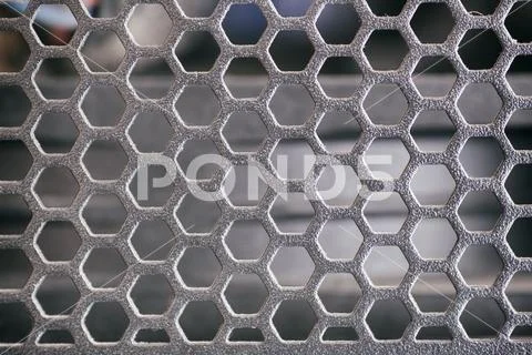 Honeycomb metal grid. Stock Image ~ Royalty Free #98550206