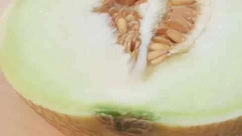 Honeydew melon cut into half and quarter slices. Video stock 159830643