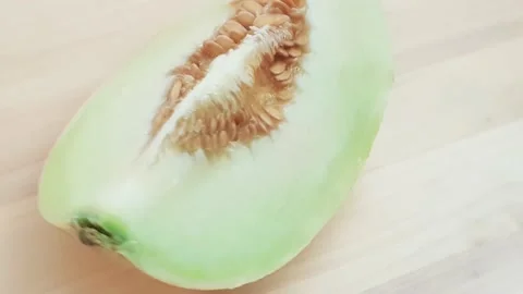 Honeydew melon cut into half and quarter slices. Stock Footage 159830662