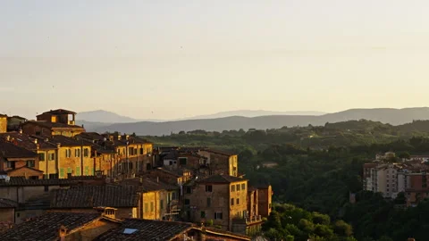 Honeyed Sunlight Across Ancient Rooftops and Verdant Valleys Stock Footage 256234974