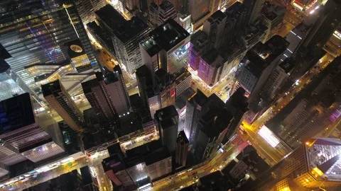 Hong Kong Aerial v25 Flying over Causeway Bay downtown panning down at night. Stockbeeldmateriaal 75886053