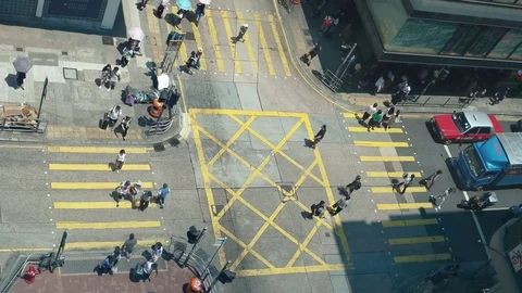 Hong Kong - Aerial view of people and traffic at small busy junction. Speed up. Stock Footage 79582353