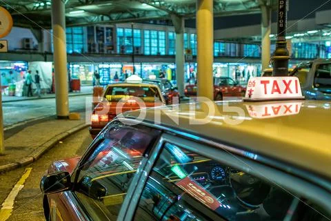 Hong Kong - April 12: Taxis On The Street On April 12, 2014 In Hong Kong. Ove