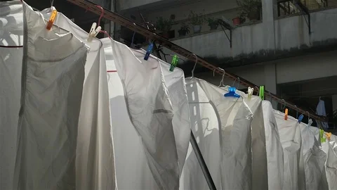 Hong Kong - Close up of hanging sheets in typical residential building Stock Footage 70525309