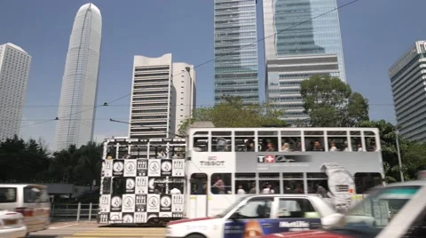 HONG KONG- Double decker trams and traffic in modern city centre. 4K Stock Footage 56454476