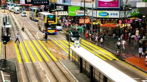 HONG KONG -  Double decker trams and people on crosswalk. Causeway bay. 4K Stock Footage 58848531