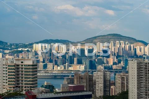 Hong Kong Downtown with mountains. Financial district in smart city. Skyscrap Stock Photos