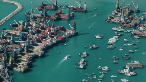 Hong Kong - Elevated view of boats in port with docking crane vessels. 4K Stock-Footage 81698418