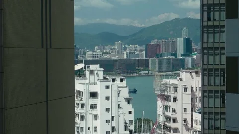 HONG KONG -Elevated view of high rise buildings and ship on the sea Stock Footage 81181262