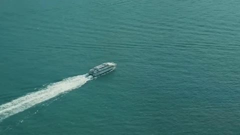 Hong Kong - Elevated view of high speed ferry leaving port. Close up. Stock Footage 81703560