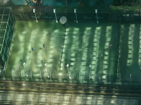 Hong Kong - Elevated view of people playing tennis on rooftop. Stock Footage 79382401