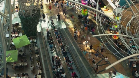 Hong Kong - Elevated view of people on escalators in shopping mall. 4K Stock Footage