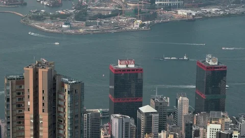 Hong Kong - Elevated view of Victoria Harbour with skyscrapers and boats. 4K Stock Footage 80687143