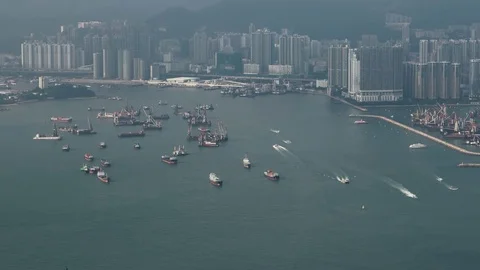 Hong Kong - Elevated view of Victoria Harbour with cargo ships. 4K resolution. Stock Footage 80687199