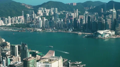 Hong Kong - Elevated view of Victoria Harbour with skyscrapers and boats. 4K Stock Footage 82176943