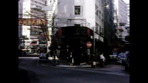 Hong Kong intersection with shops VW bus - 1960s Stock-Footage 231199553