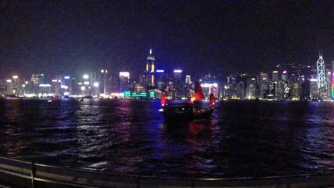Hong Kong light show and boat in the foreground Stock Footage 254584792