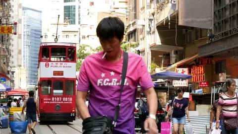 HONG KONG - low angle of man with cigarette 動画素材 73822452