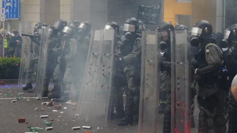 Hong Kong Riots Protesters Take Cover Stock Footage 114771325