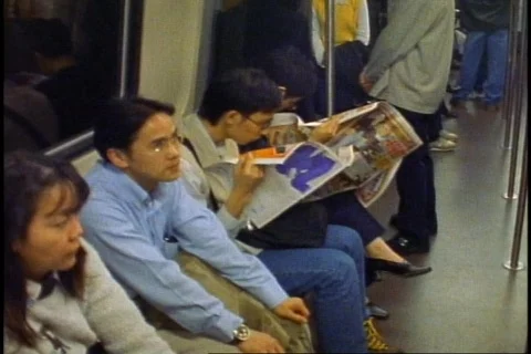 Hong Kong Subway, inside of train, crowd, moving, medium close-up Stock Footage 868087