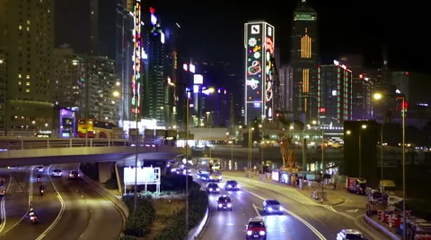 Hong Kong traffic intersection with tall Christmas lights illuminated buildings Vidéo 45588871