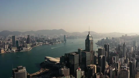 Hong Kong Victoria Harbour Skyline and Financial District Aerial, Golden Sunrise Stock Footage 334239341