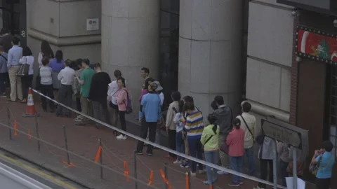 Hong Kong voters queue at polling station Stock Footage