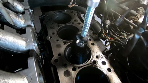 Honing the cylinders in the head of a car engine Stock Footage 171084921