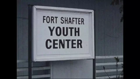 HONOLULU - 1978: Post facilities - A board fronts a lawn and fence Stock Footage 343937006