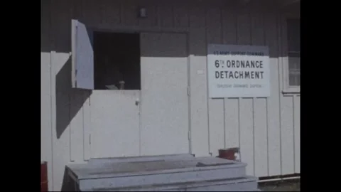 HONOLULU - 1978: Post grounds - Red flowers bank up against a wall Stock-Footage 343936738