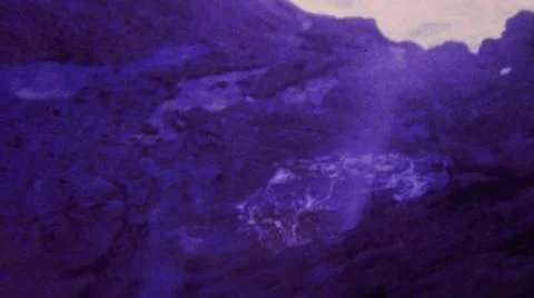 HONOLULU HAWAII USA-1964: Exploding Blue Water Geyser Rock Volcano Flowing Stock Photos
