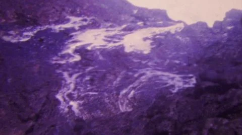 HONOLULU HAWAII USA-1964: Exploding Blue Water Geyser Rock Volcano Flowing Stock Photos