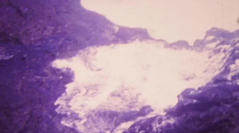HONOLULU HAWAII USA-1964: Exploding Blue Water Geyser Rock Volcano Flowing Stock Photos
