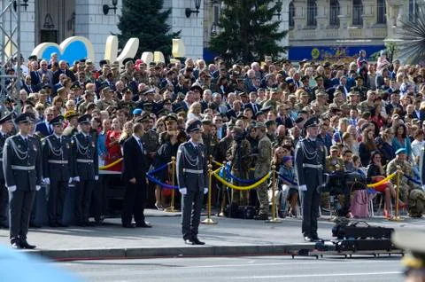 Honor guards standing in a line during military parade, crowd watching on a b Foto stock